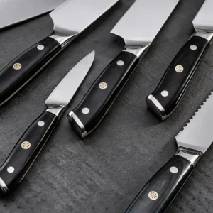 Close-up of kitchen knife set black pakkawood handles with mosaic rivets on workbench setting. SKU: KL-KK-ST-020