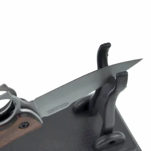 Close-up of tactical folding knife satin blade displayed on a black stand, isolated on white background. KL-OD-SS-009