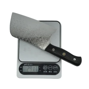 Close-up of Damascus steel meat cleaver highlighting seamless welding technology on a wooden bolster background. KL-KN-DS-004