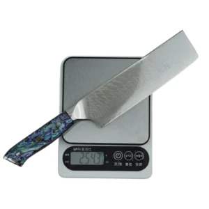 Weighing a Damascus nakiri vegetable knife on a digital scale, isolated on white background. KL-KN-DS-001-22