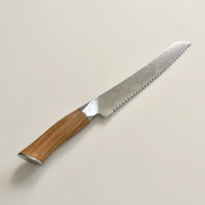 Damascus serrated bread knife with natural olive wood handle side view isolated on white background KL-KN-DS-022