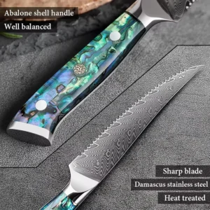 Damascus serrated steak knife with abalone shell handle on workbench setting KL-KN-OS-003