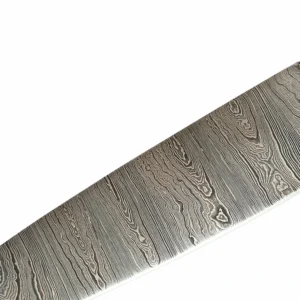 Close-up of acid-etched Damascus steel pattern on chef knife blade isolated on white background KL-KK-DS-002