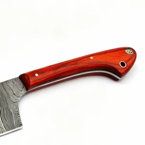Close-up of ergonomic red pakkawood handle on Damascus steel chef knife isolated on white background KL-KK-DS-002