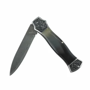 Damascus steel folding knife with engraved bolsters and natural horn handle half-open isolated on white background. SKU: KL-OD-SS-007.
