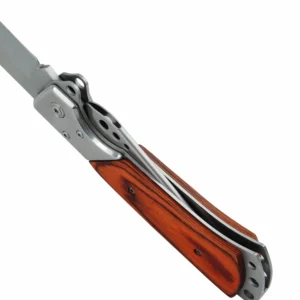 Detailed view of a folding hunting knife handle and locking mechanism isolated on white background. SKU: KL-OD-SS-004.