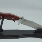 Fixed blade hunting knife with a pakkawood handle placed on a black display stand. KL-OD-HC-001-13