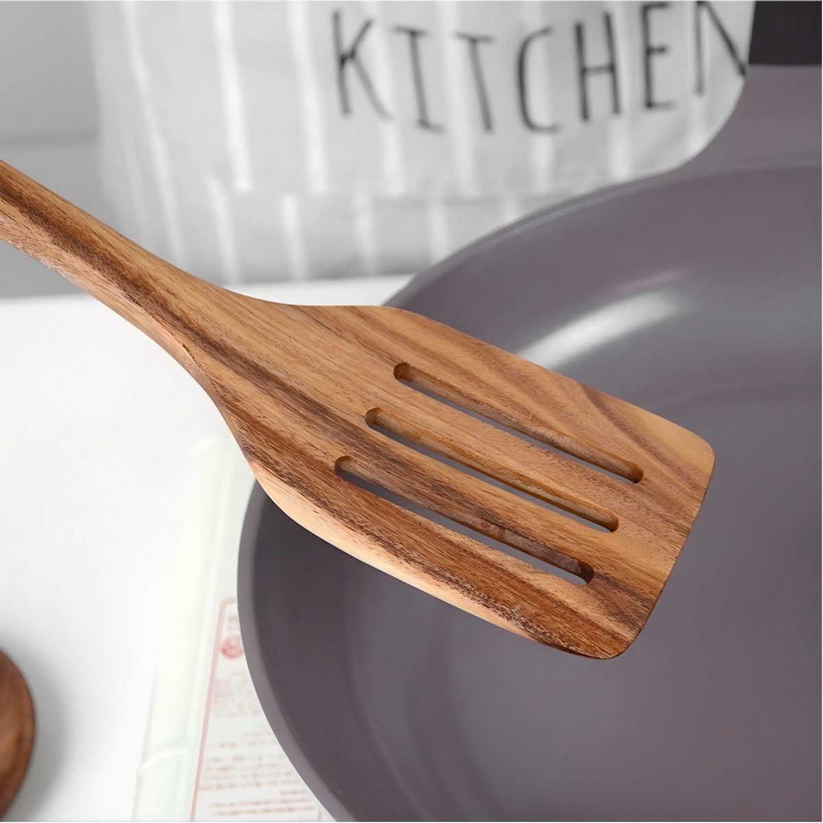 Natural wood slotted spatula blade detail on workbench setting. KL-KA-GAD-006