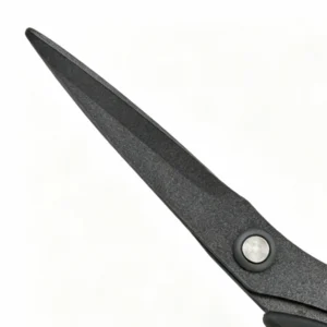 Close-up of matte black non-stick coating blades on office scissors isolated on white background KL-SC-TI-002