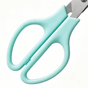 Detailed view of mint teal ergonomic loop handles on quail egg scissors isolated on white background KL-SC-KT-004