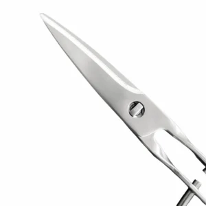Close-up of serrated upper blade on stainless steel kitchen scissors isolated on white background, SKU KL-SC-PR-013.