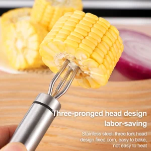 Stainless steel 3-prong BBQ fork head holding corn cob on wooden tabletop KL-KA-BBQ-001