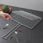 Stainless steel square BBQ grill basket shown partially open on workbench setting KL-KA-BBQ-005