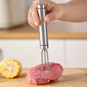 Stainless steel 4-prong BBQ meat fork held in hand for scale on wooden cutting board KL-KA-BBQ-001