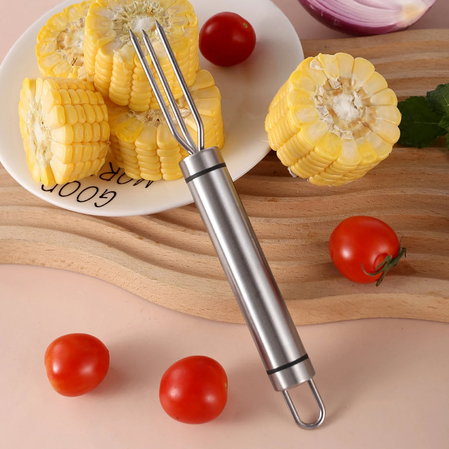Stainless steel 4-prong BBQ meat fork displayed on wooden tabletop in kitchen environment KL-KA-BBQ-001
