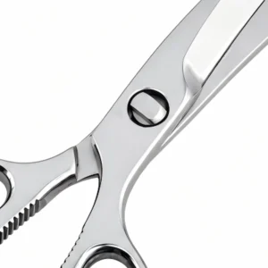 Close-up of mirror-polished pivot screw and serrated bone cracker on poultry shears isolated on white background KL-SC-SS-008.