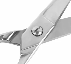 A detailed close-up of the adjustable flat-head pivot screw and mirror polished joint of barber scissors, SKU: KL-SC-HC-002.