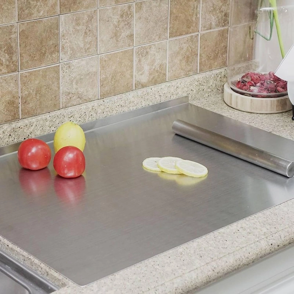 Stainless steel pastry board with rolling pin and lemon slices in kitchen environment KL-KA-CB-003