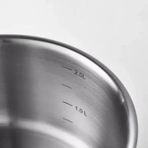 Stainless steel saucepan interior brushed finish with engraved capacity measurement marks isolated on white background KL-KA-CU-002