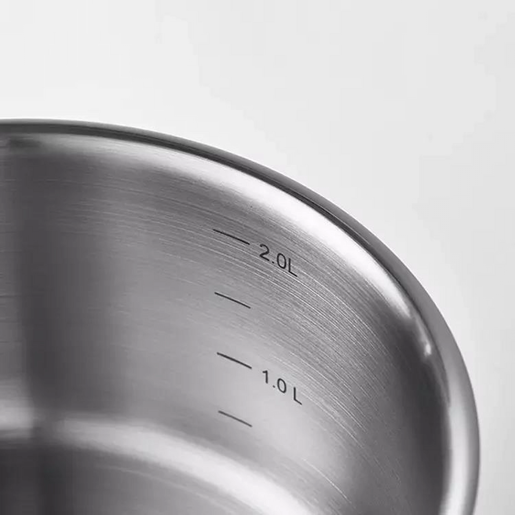 Stainless steel saucepan interior brushed finish with engraved capacity measurement marks isolated on white background KL-KA-CU-002
