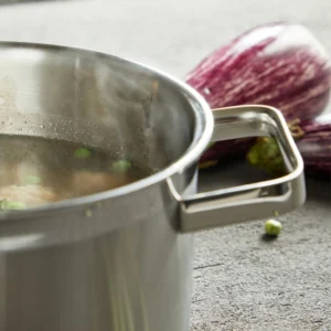 Stainless steel stock pot boiling soup with vegetables on workbench setting KL-KA-CU-001