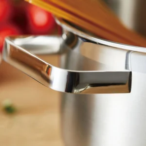 Stainless steel stock pot ergonomic handle close up displayed on wooden tabletop KL-KA-CU-001