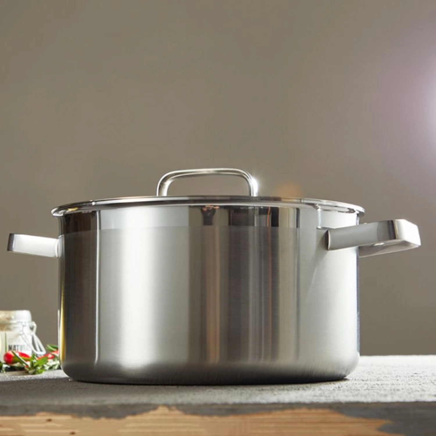 Stainless steel stock pot with lid and side handles on workbench setting KL-KA-CU-001