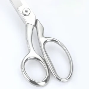 A detailed close-up of the polished mirror finish on the asymmetric handles of tailor scissors, SKU: KL-SC-HC-001.