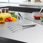Stainless steel 4-prong meat carving fork displayed in kitchen environment KL-KA-BBQ-006