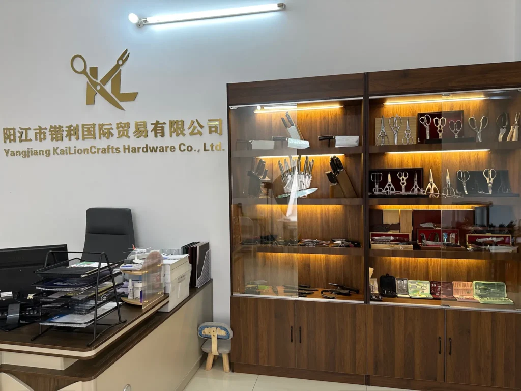 Yangjiang KaiLionCrafts office reception with wooden cabinets displaying sample kitchen knives and scissors.