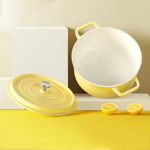 Yellow enameled cast iron Dutch oven with separate lid on workbench setting. KL-KA-CU-005