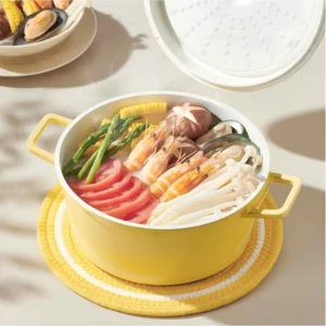 Yellow enameled cast iron Dutch oven with separate lid on workbench setting. KL-KA-CU-005