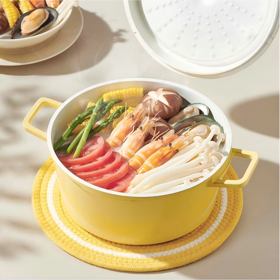 Yellow enameled cast iron Dutch oven with separate lid on workbench setting. KL-KA-CU-005